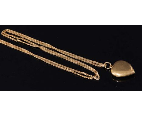 An Anglo-Indian high carat gold heart-shaped hinged locket and chain, c.1900 , the hinged heart-shaped locket suspended on a 