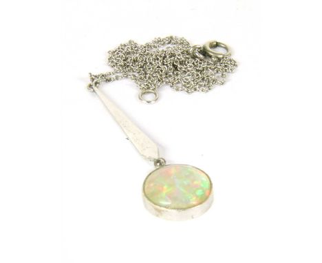 An Art Deco white gold opal Edna May pendant, with a flat section elongated kite-shaped bar with a circular cabochon opal, ru