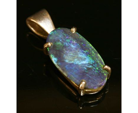 A silver single stone black opal pendant, with an oval cabochon black opal, four claw set to a plain collet with a 'V' shaped