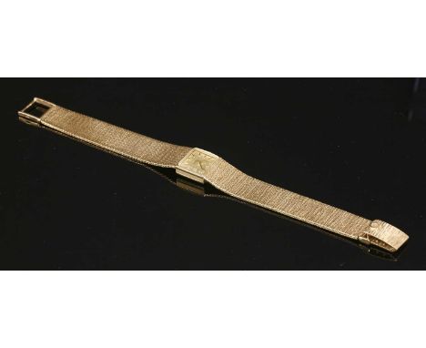 A ladies' 9ct gold Omega mechanical bracelet watch, c.1960, with a square champagne dial, with raised black hands and batons.