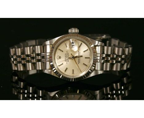 A ladies' stainless steel Rolex Oyster Perpetual Datejust automatic bracelet watch, model no. 69174. A silvered dial with rai