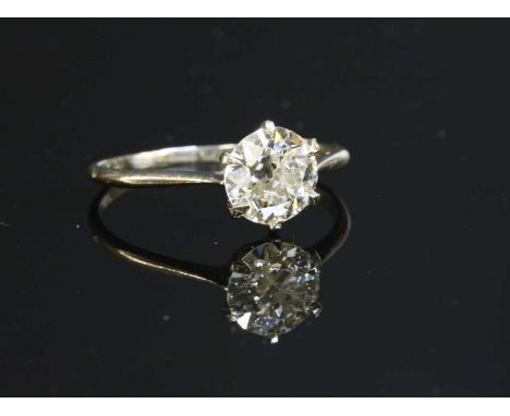 A single stone diamond ring, with an old European cut diamond, estimated as approximately 0.90ct, six claw set to a sea scrol