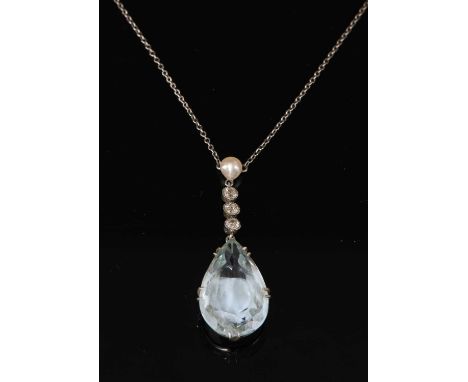 A cased aquamarine, diamond and pearl Edna May pendant, c.1915, with a pear cut aquamarine, double claw set to a shallow coll
