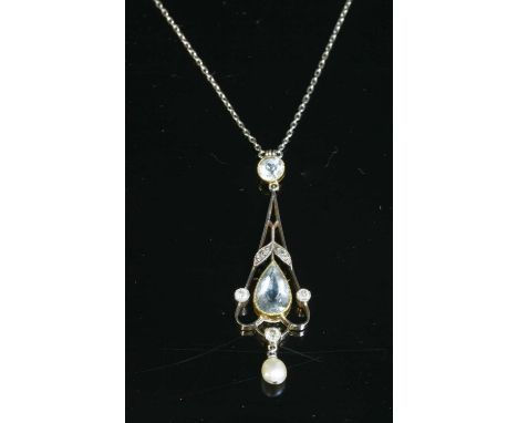 An Edwardian aquamarine, diamond and pearl pendant, with a pear cut aquamarine, milligrain set in a yellow collet, to the cen