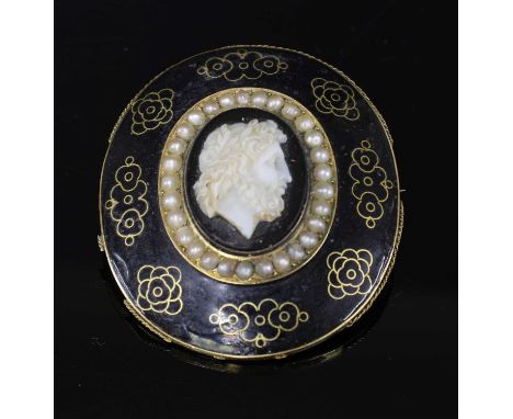 A Victorian hardstone cameo memorial brooch, with an oval sardonyx cameo, depicting a gentleman with a beard in white to a bl
