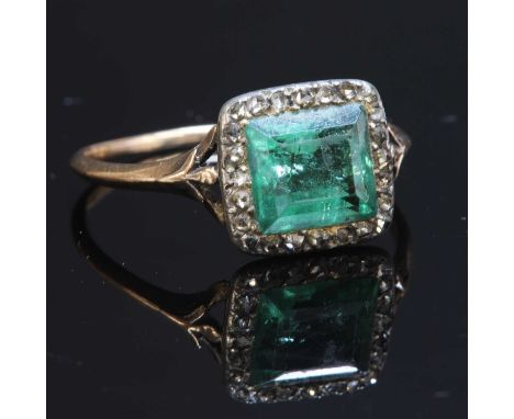 A Georgian foiled emerald and diamond square cluster ring, with a rectangular step cut emerald, set to a border of rose cut d