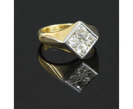 A 9ct gold four stone diamond offset square signet ring, with four old European cut diamonds, claw set to a platinum plate. C