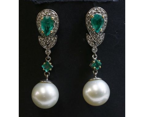 A pair of two colour gold emerald, diamond and South Sea pearl drop earrings, a pear cut emerald, four claw set with yellow c