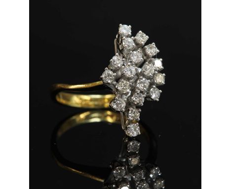 An 18ct gold diamond set spray ring, with brilliant cut diamonds, all four claw set in white wire collets to a white wire bas