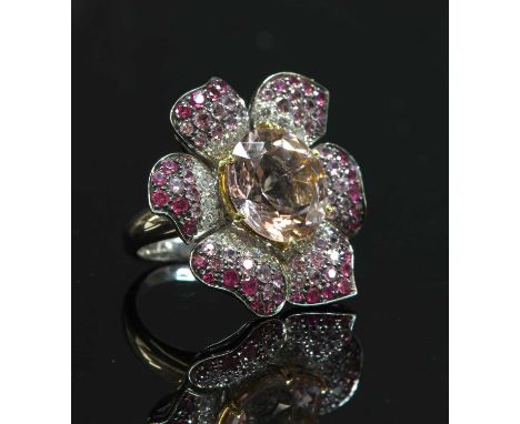 A white gold morganite, pink sapphire and diamond flowerhead cluster ring, by Picchiotti, with a circular mixed cut morganite