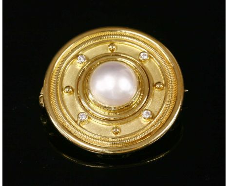 An 18ct gold mabé pearl and diamond brooch, by Cassandra Goad, with a detachable brooch fitting. Circular shield form, with a