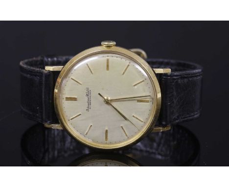 A gentlemen's 18ct gold International Watch Co. Schaffhausen mechanical strap watch, c.1958-1959, a circular case 35mm diamet