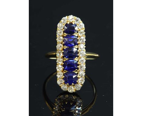 An Edwardian five stone sapphire and diamond cluster fingerline ring, c.1905, a central vertical row of five cushion-shaped m