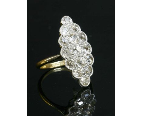 A diamond set marquise cluster ring, with graduated cushion cut and old European cut diamonds, grain and milligrain set to a 