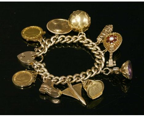 A 9ct gold curb chain bracelet, with ten assorted charms attached, to include a 1929 sovereign, a 1913 half sovereign, an Ita