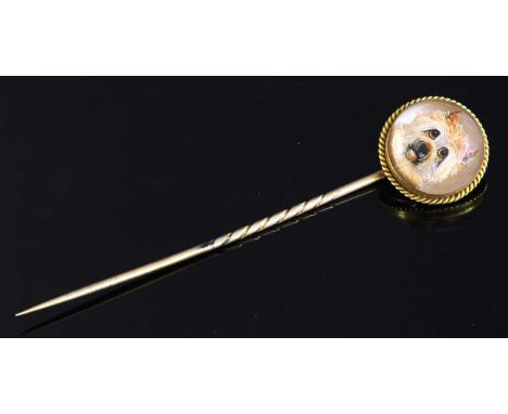 A Victorian gold reverse painted intaglio stick pin, depicting what is believed to be a Norfolk terrier. The circular domed i