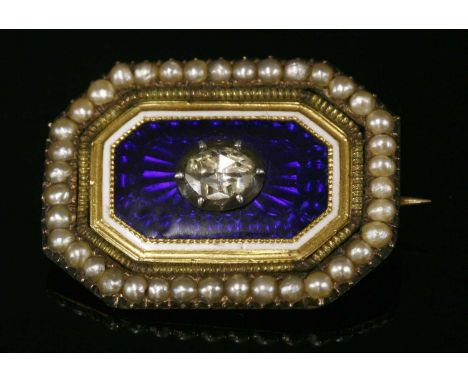 A Georgian diamond, enamel and seed pearl brooch, with an oval rose cut diamond, foiled and set to a cut down collet. A blue 