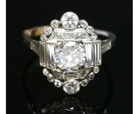 An Art Deco diamond set plaque-style cluster ring, with a brilliant cut diamond, estimated as approximately 1.00ct, claw set 