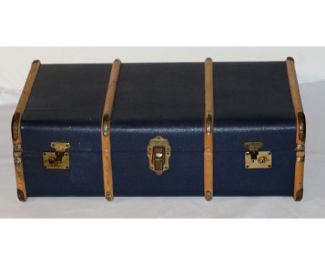 A RIBBED TRAVEL TRUNK BY OVERPOND. H32CMxW92CMxD50CM
