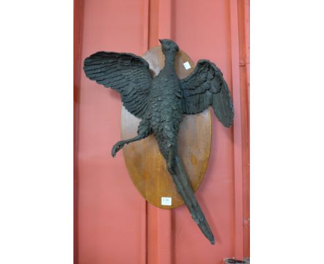 A bronze pheasant, mounted on mahogany wall plaque