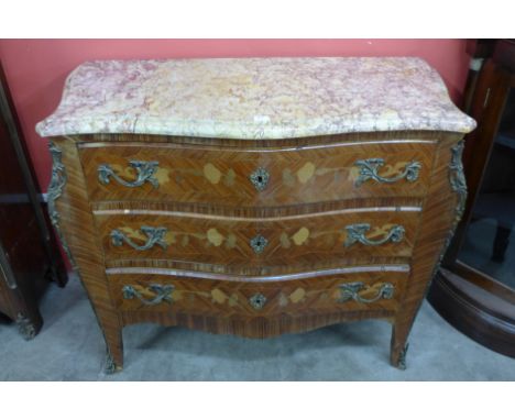 A French Louis XV style kingwood and marquetry inlaid bombe commode with serpentine top