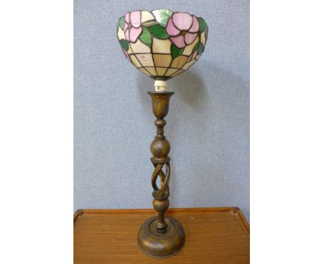 An Islamic black and gilt table lamp with Tiffany style light shade