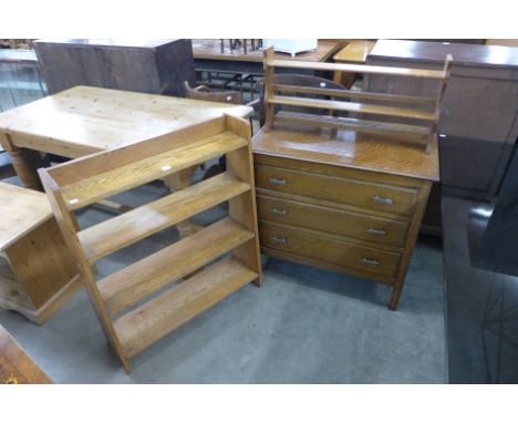 An oak chest of drawers, oak open bookcase and an oak wall shelf