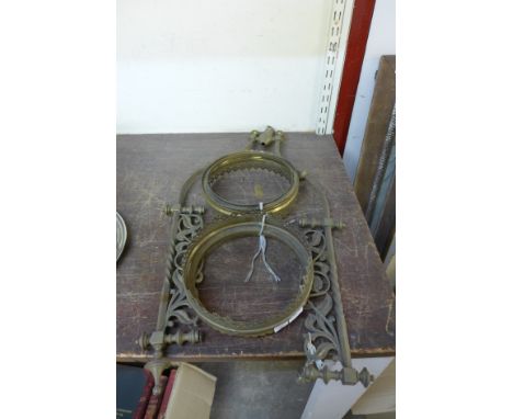 An Arts and Crafts brass light frame