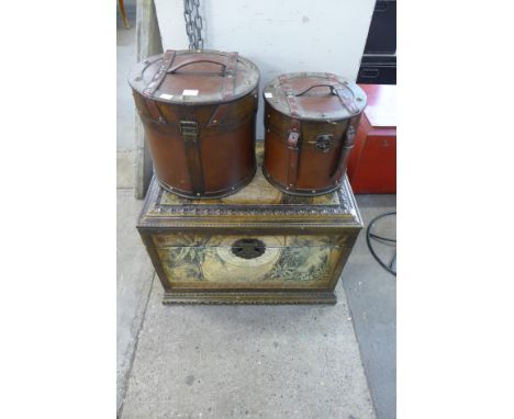 A pair of hat boxes and a world map themed trunk