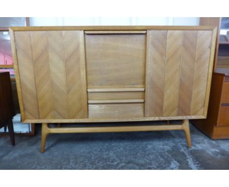 A light oak herringbone pattern sideboard 