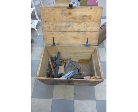 A pine tool chest with tools 