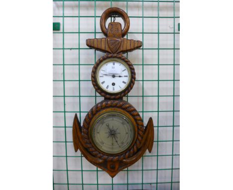 A Victorian carved oak anchor shaped aneroid barometer and clock 