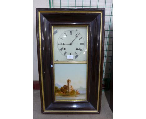 A 19th Century American simulated rosewood 8-day spring driven ogee wall clock