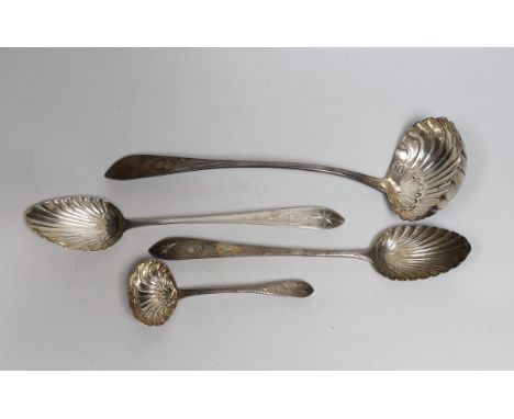 A George IV silver bright cut engraved soup ladle, with fluted bowl, Lawrence Nolan, Dublin, 1827, 34.5cm, a pair of George I