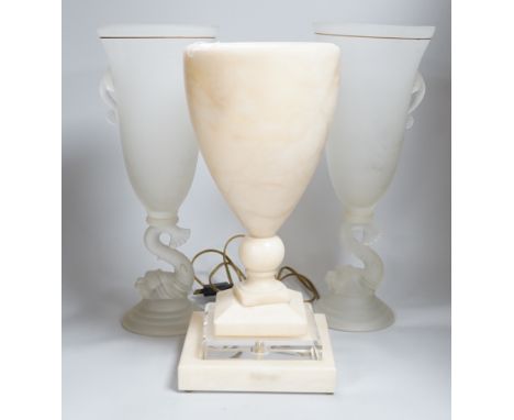 A glass uplighter table lamp in the style of alabaster and two frosted glass dolphin vases