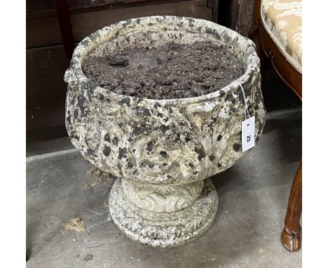 A circular reconstituted stone garden planter, diameter 42cm, height 46cm