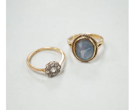 A 1920's 18ct and diamond set flower head cluster ring, size N, gross weight 2.4 grams and a 9ct ring, gross 4.2 grams.