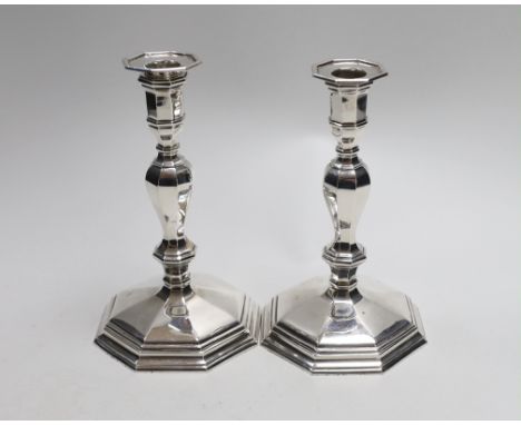 A pair of Queen Elizabeth II cast silver candlesticks, on octagonal bases, H&amp;R, London, 1994, height 17.3cm, 30.9oz.