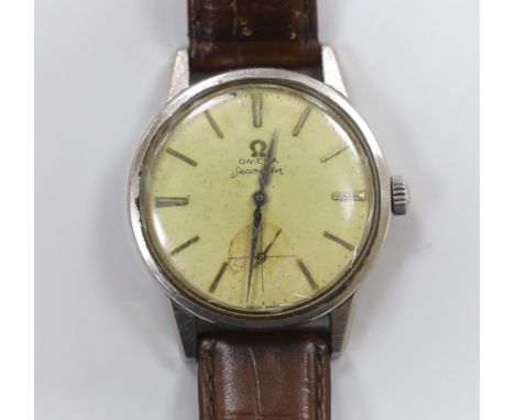 A gentleman's 1960's? stainless steel Omega Seamaster manual wind wrist watch, on associated leather strap.