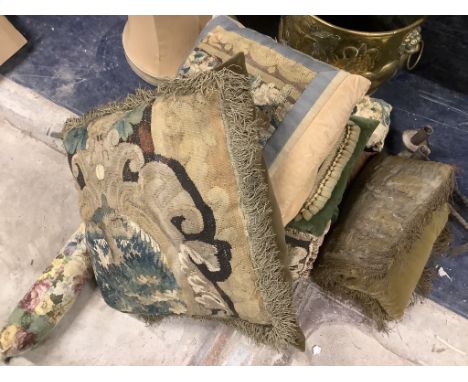 Nine assorted tapestry cushions and a tapestry hanging fragment