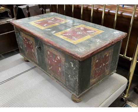 A 19th century Swiss painted pine trunk, width 110cm, depth 60cm, height 51cm