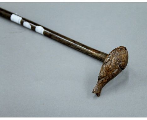 A Chinese wooden staff, the finial formed as a fish. 150 cm long.