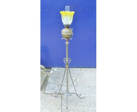 A Victorian brass standard lamp with etched yellow glass shade. 145 cm high overall.