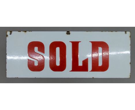 An enamel Sold sign. 49 x 18.5 cm.
