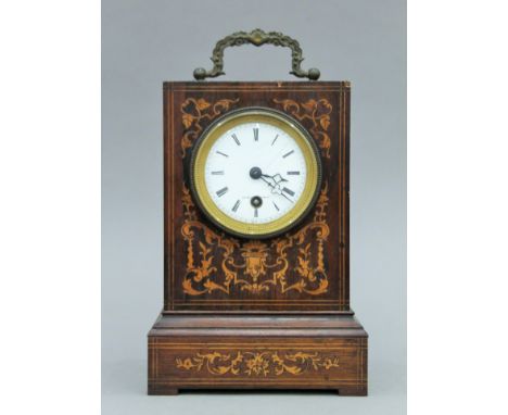 A 19th century inlaid rosewood mantle clock. 23 cm high.