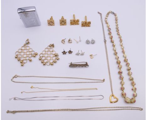 A small quantity of miscellaneous jewellery including earrings, cufflinks, necklaces, a brooch and a Zippo lighter.  Beaded n
