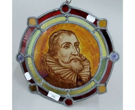 A stained lead glazed panel depicting Miguel de Cervantes. 32 cm diameter.