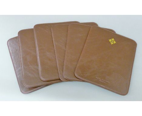 Six Patek Philippe place mats. 19.5 x 23 cm.