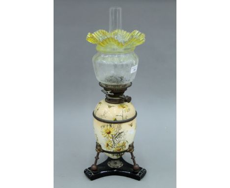 A Victorian porcelain oil lamp with etched glass shade. 59 cm high overall.