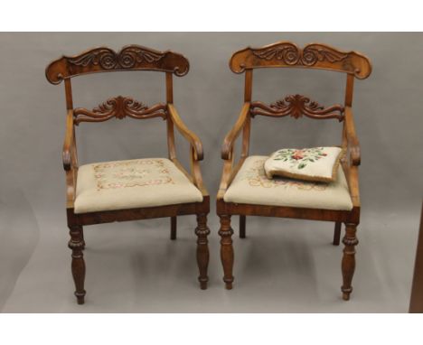 A pair of 19th century mahogany open armchairs with tapestry seats. 54 cm wide.